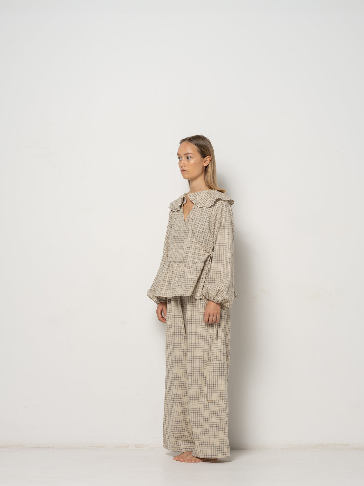Ada Mini Collar Blouse, this collar checkered blouse features inside and outside straps, providing both elegance and functionality. Made from a blend of Hemp and Organic Cotton Yarn, it offers durability for an eco-friendly addition to your wardrobe.