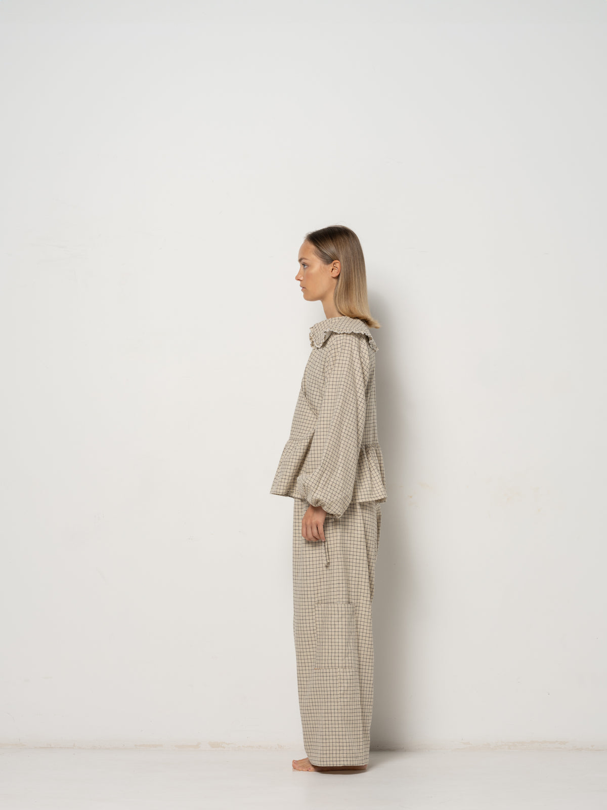 Ada Mini Collar Blouse, this collar checkered blouse features inside and outside straps, providing both elegance and functionality. Made from a blend of Hemp and Organic Cotton Yarn, it offers durability for an eco-friendly addition to your wardrobe.