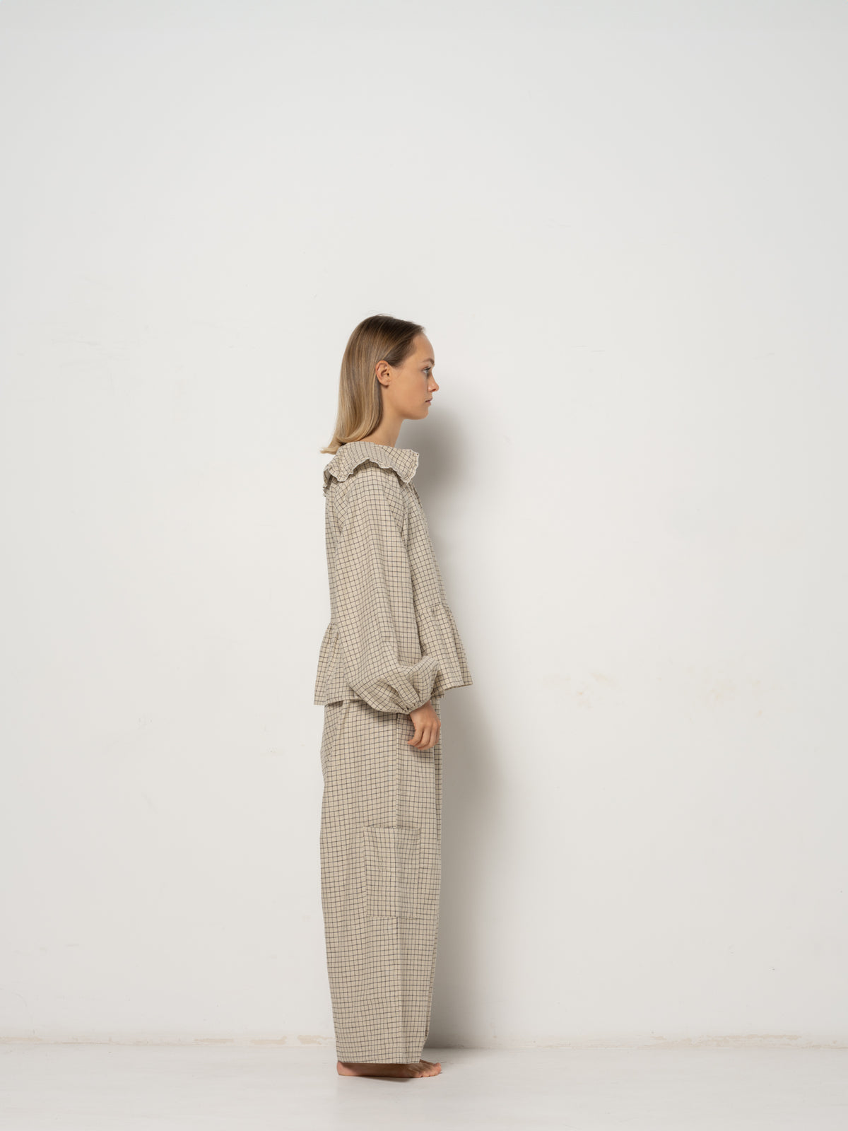 Ada Mini Collar Blouse, this collar checkered blouse features inside and outside straps, providing both elegance and functionality. Made from a blend of Hemp and Organic Cotton Yarn, it offers durability for an eco-friendly addition to your wardrobe.