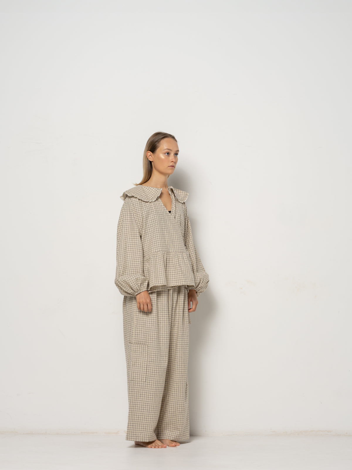 Ada Mini Collar Blouse, this collar checkered blouse features inside and outside straps, providing both elegance and functionality. Made from a blend of Hemp and Organic Cotton Yarn, it offers durability for an eco-friendly addition to your wardrobe.
