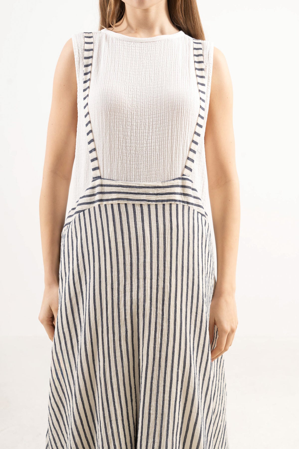Detailed close-up showing the soft, breathable weave texture and fine stitching of the MOCHA 100% cotton skirt.