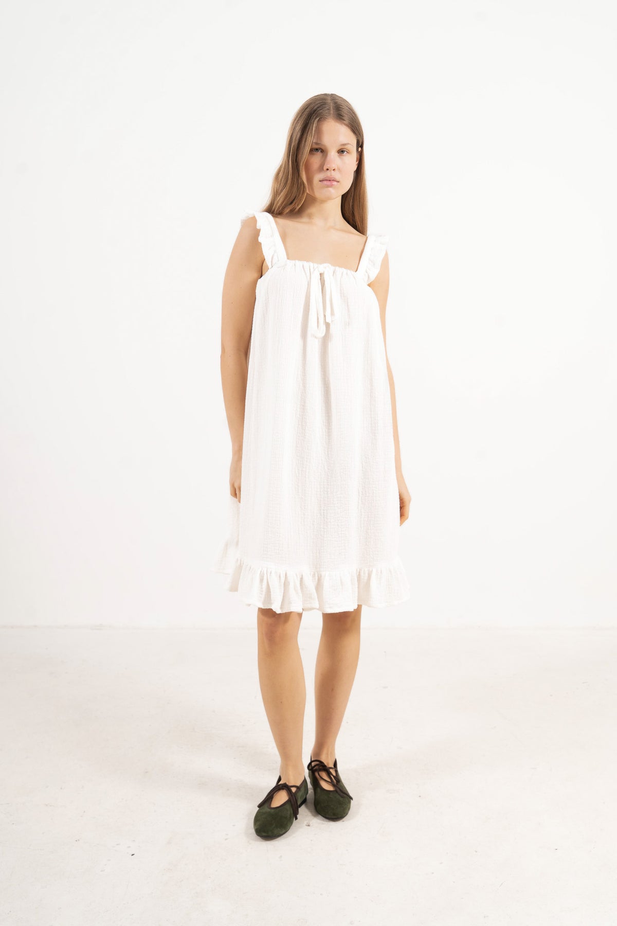 Front view studio portrait featuring a model in the Céline Dress by MOCHA, showcasing its effortless elegance, flowing silhouette, and refined fit.