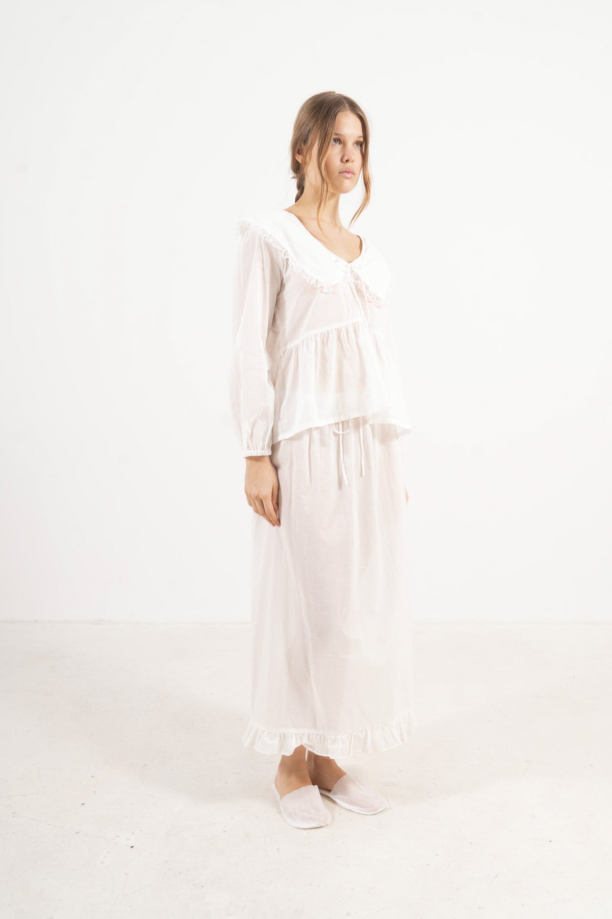 Side lookbook capture of the premium cotton lounge set, showcasing how the weightless fabric drapes beautifully and effortlessly.