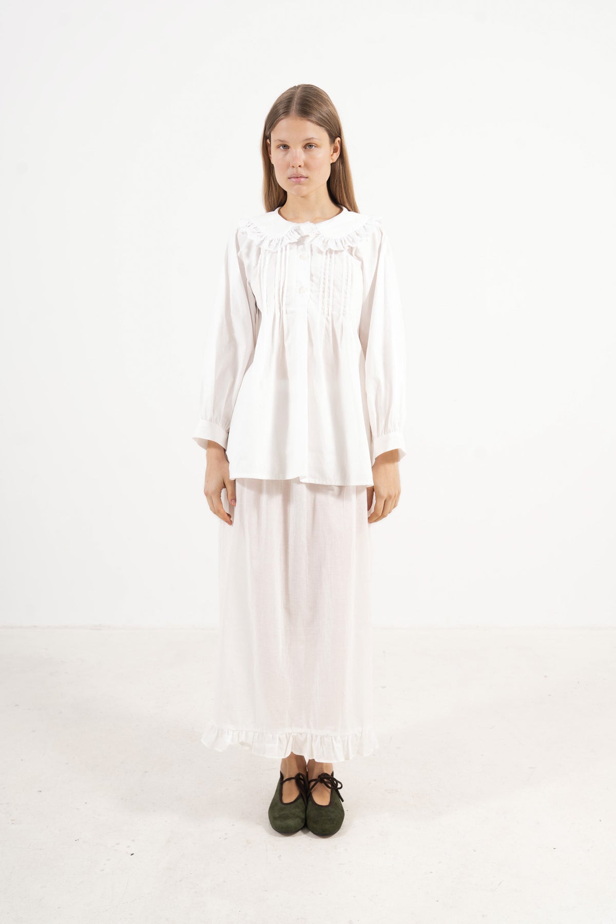Front view studio portrait featuring a model in the Juliette Blouse by MOCHA, capturing its quiet elegance, soft drape, and effortless lightness.
