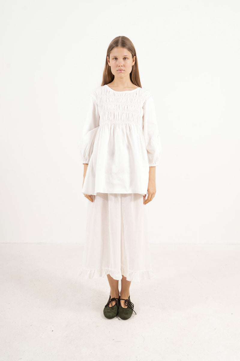 Front view studio portrait featuring a model in the La Cour Blouse by MOCHA, capturing its aristocratic grace, soft drape, and understated opulence.