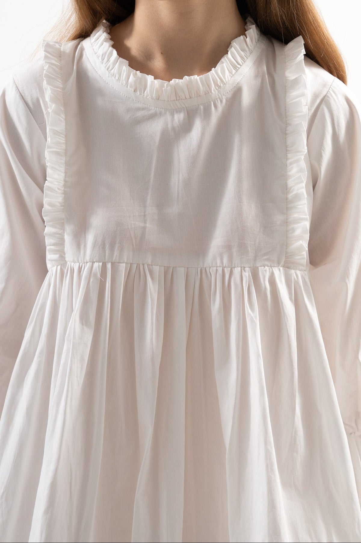 Close-up detail shot focusing on the intricate embellishments, delicate handwork, and majestic fabric textures of the MOCHA dress.