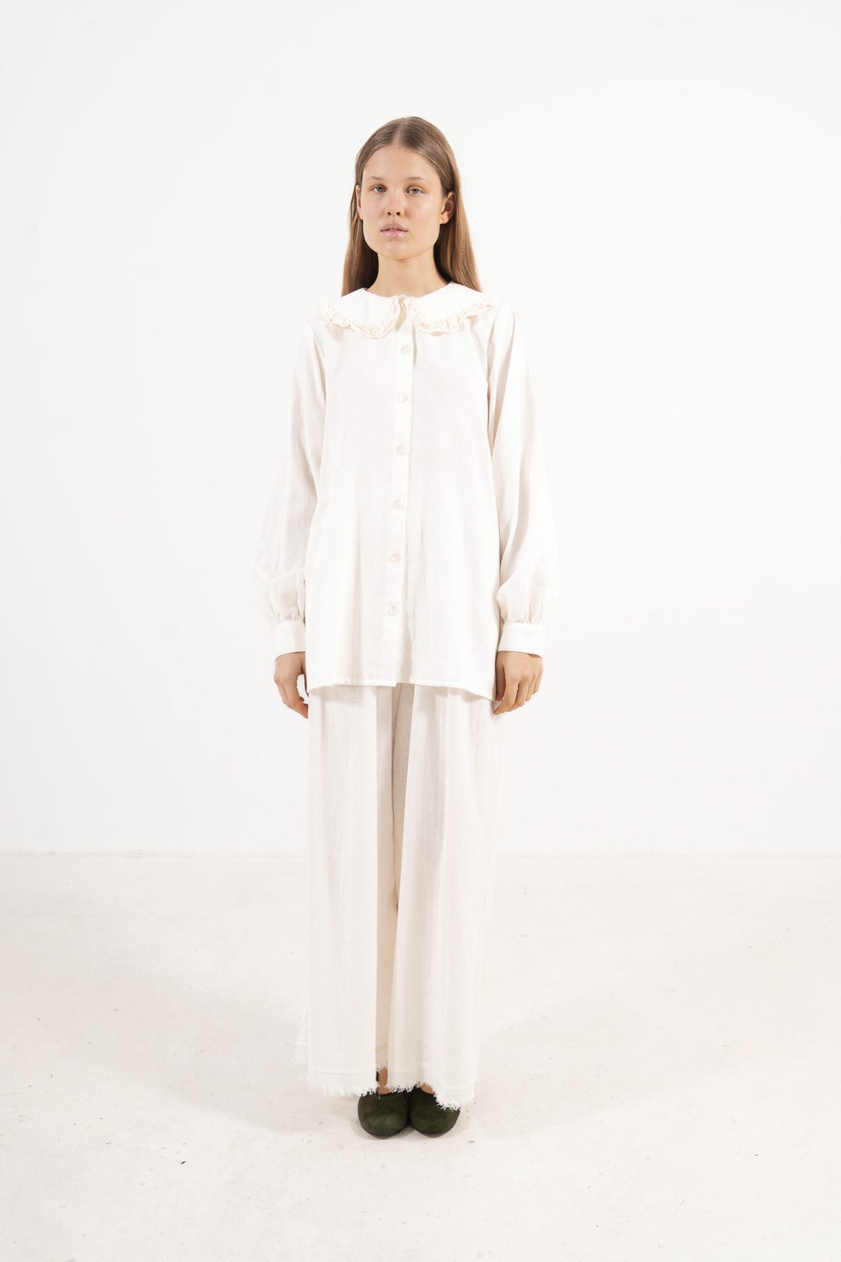 Front view studio portrait featuring a model in the Le Souffle Blouse by MOCHA, wrapping you in effortless elegance and gentle lightness.