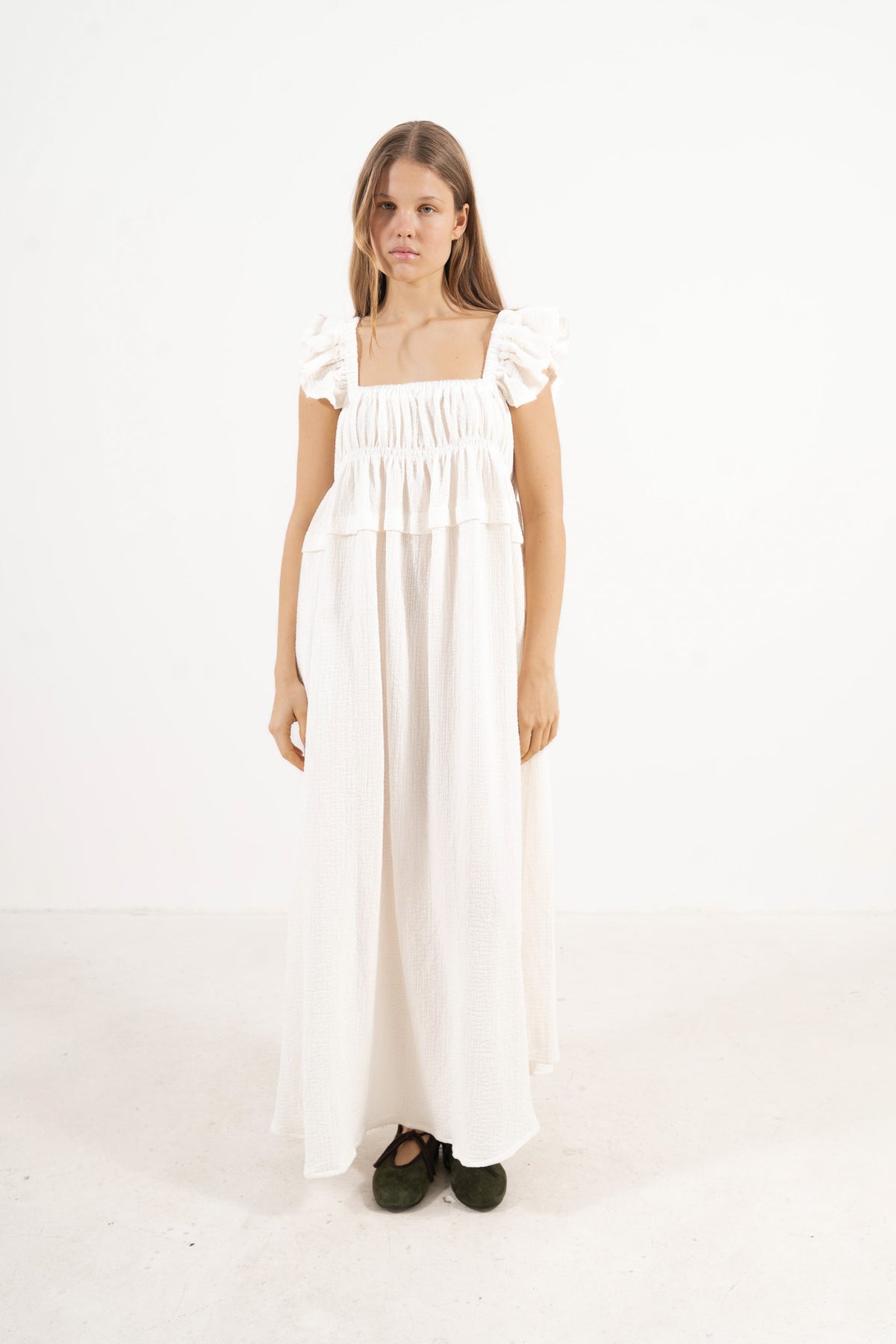 Editorial lifestyle capture of the Chloe Dress, illustrating an effortless, poetic luxury aesthetic.