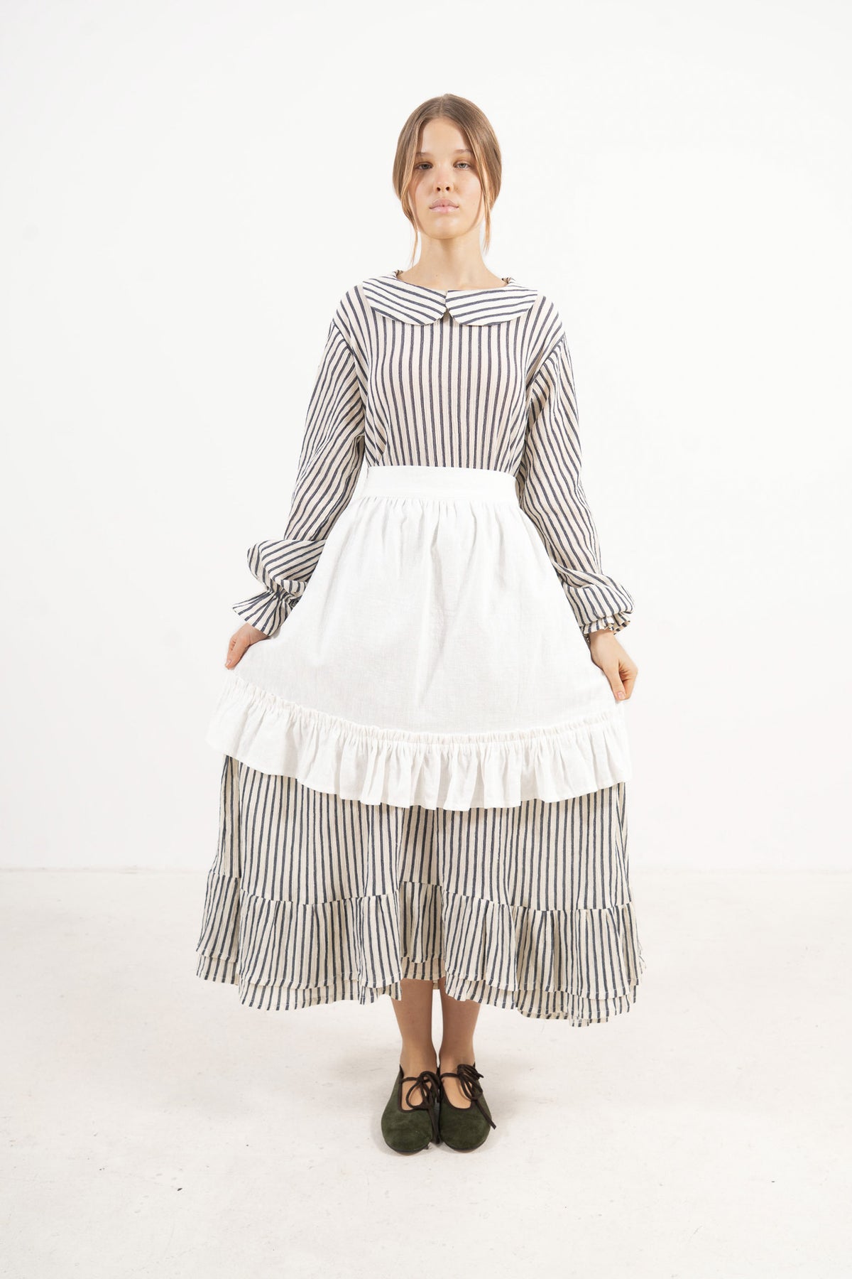  Front view studio portrait featuring a model in the Sillage Dress by MOCHA, capturing its effortless elegance and soft world of lightness.